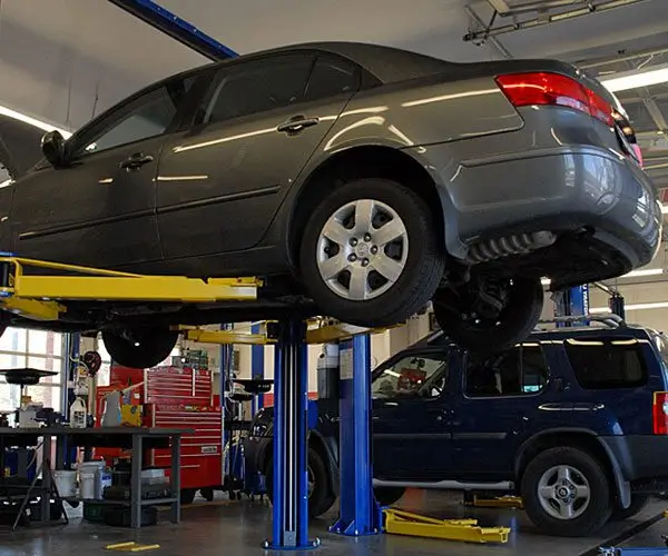 https://justfixautomotive.com.au/wp-content/uploads/2026/05/Justfix-Automotive-Mechanic-Workshop.webp